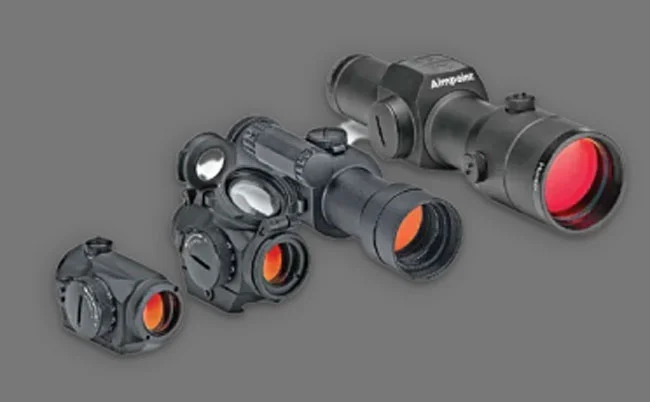 four Aimpoint red dot sights